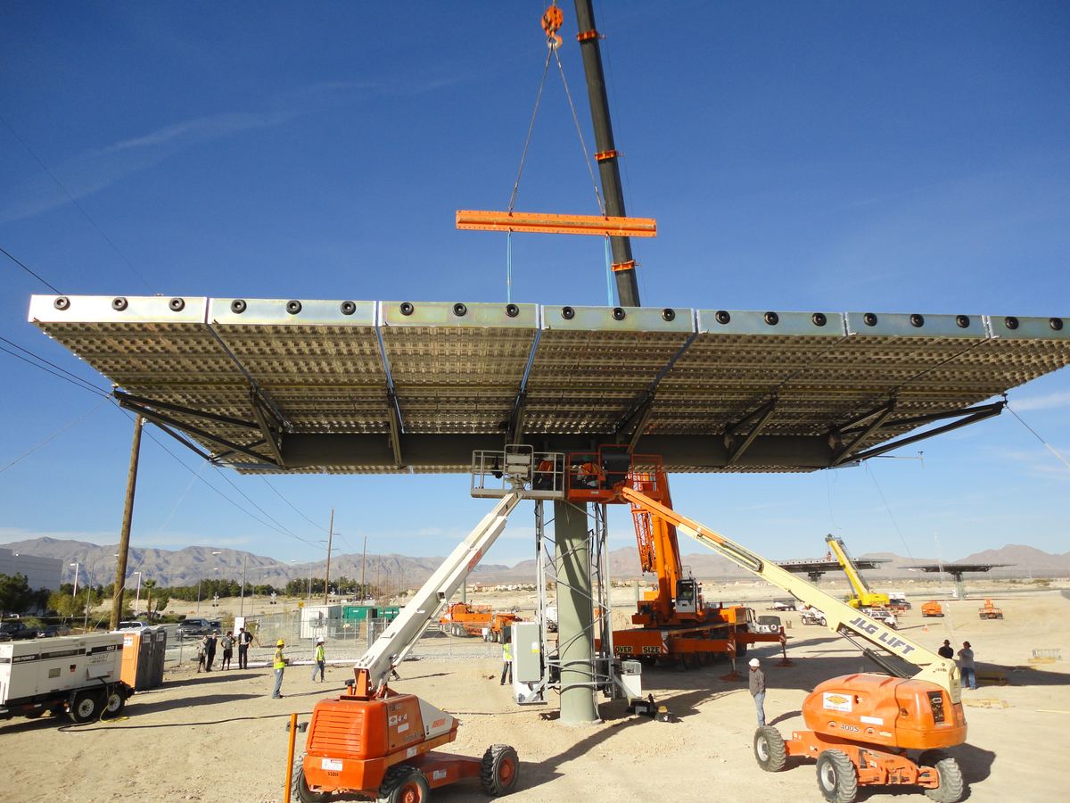A large concentrating PV tracker being lifted into place by crane