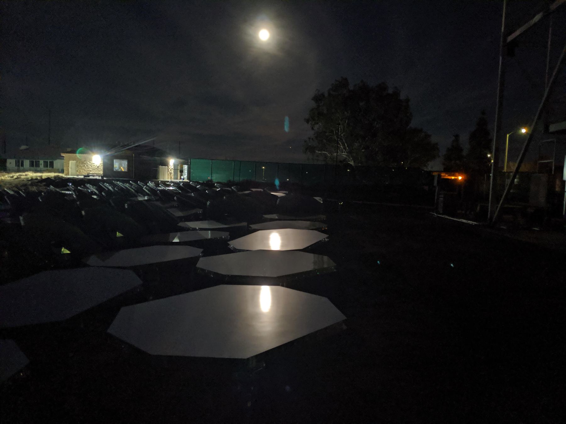 Heliostat mirrors reflecting the moon at night