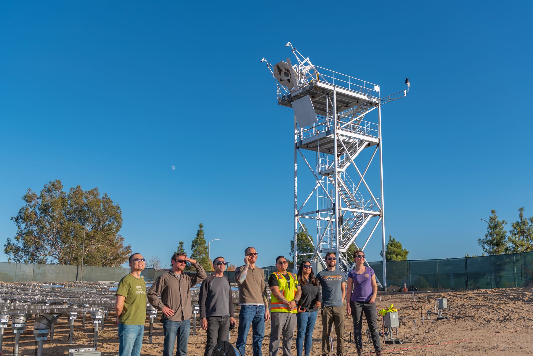 Steve with the Heliogen team in front of the test tower and heliostat field in Lancaster, California